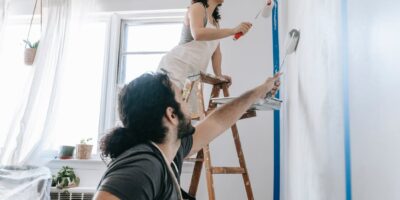 Free Couple Painting A Wall Stock Photo
