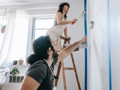 Free Couple Painting A Wall Stock Photo