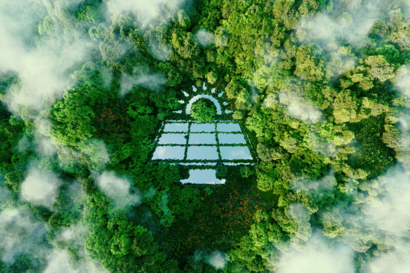 A lake in the middle of a pristine rainforest in the shape of a solar power plant symbolizing the benefits and eco-friendliness of green renewable energy. 3d rendering.